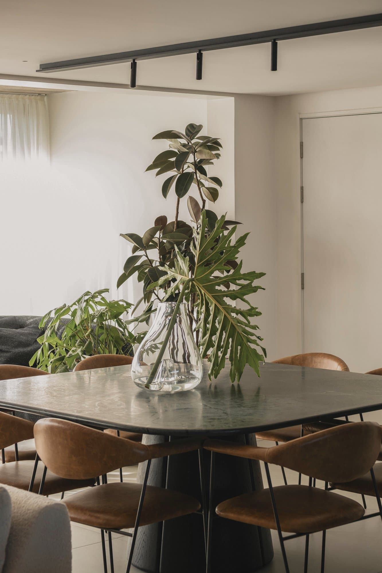 Dining table and chairs set up in a furnished corporate rental