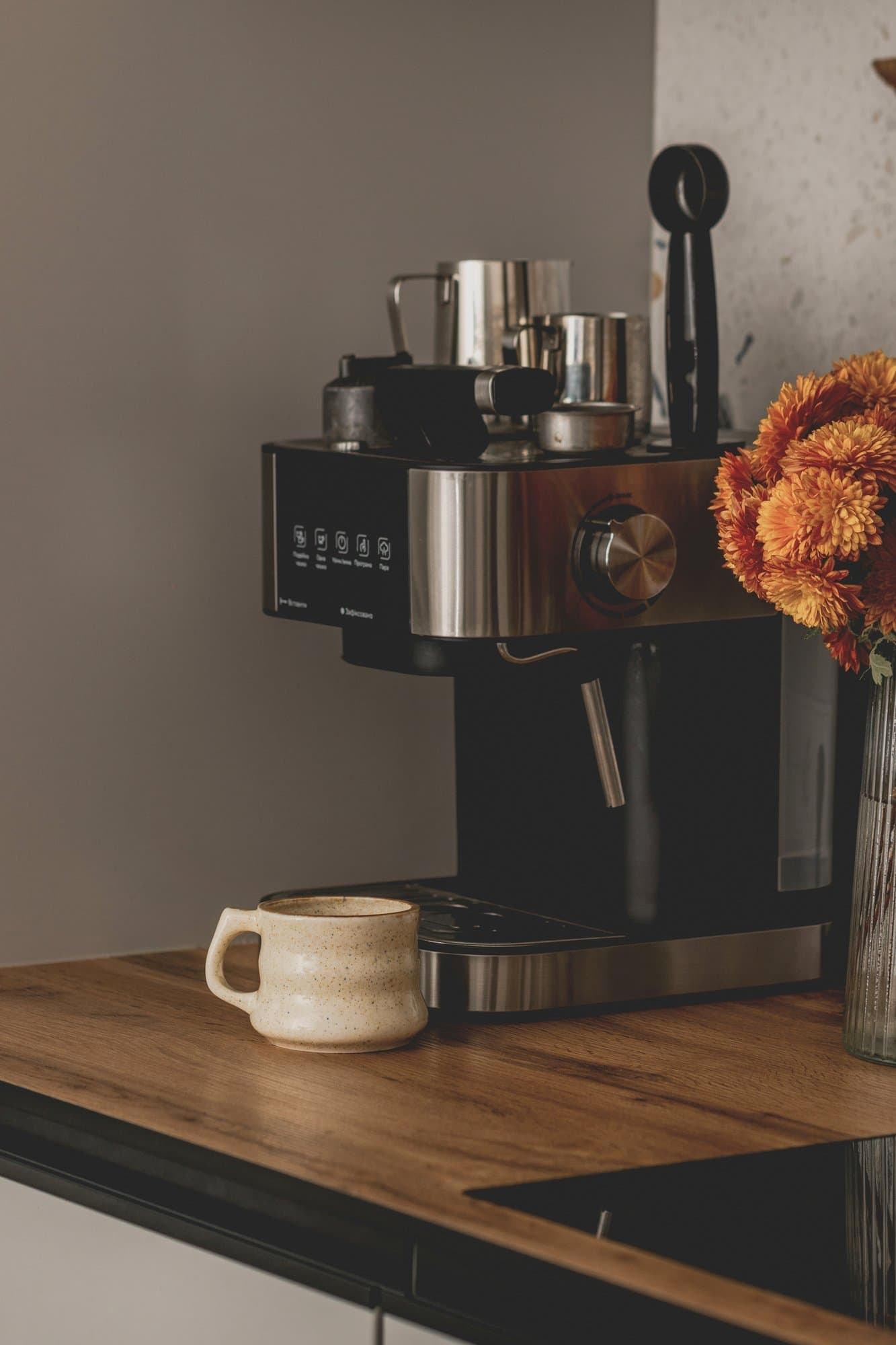 Hired kitchen appliances including an espresso machine on a bench